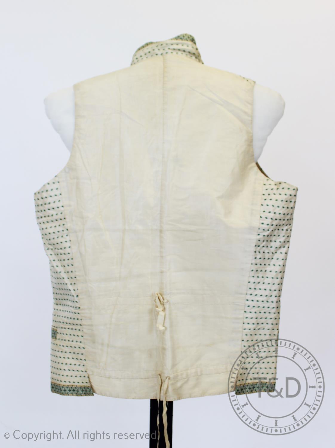 An ivory and mint green figured silk waistcoat, circa 1820, edged with figured silk braid and - Image 6 of 8