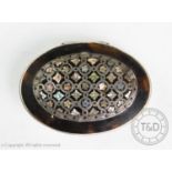 A George III white metal mounted tortoiseshell snuff box, of oval form, with abalone and mother of