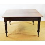 A 19th century mahogany extending dining table, with turned octagonal legs and fitted brass castors,