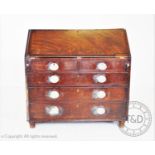 A George III mahogany bureau, with a fall front above four drawers, raised upon later feet, 104cm