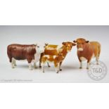 A Beswick Gurnsey cow and calf in gloss glazed finish, together with a Beswick Gurnsey bull in