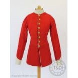 A Lancashire Regiment dress tunic and matched trousers, the scarlet coat with military buttons to