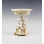 A Copeland Parian figural comport circa 1860, the central column modelled as three cherubs,