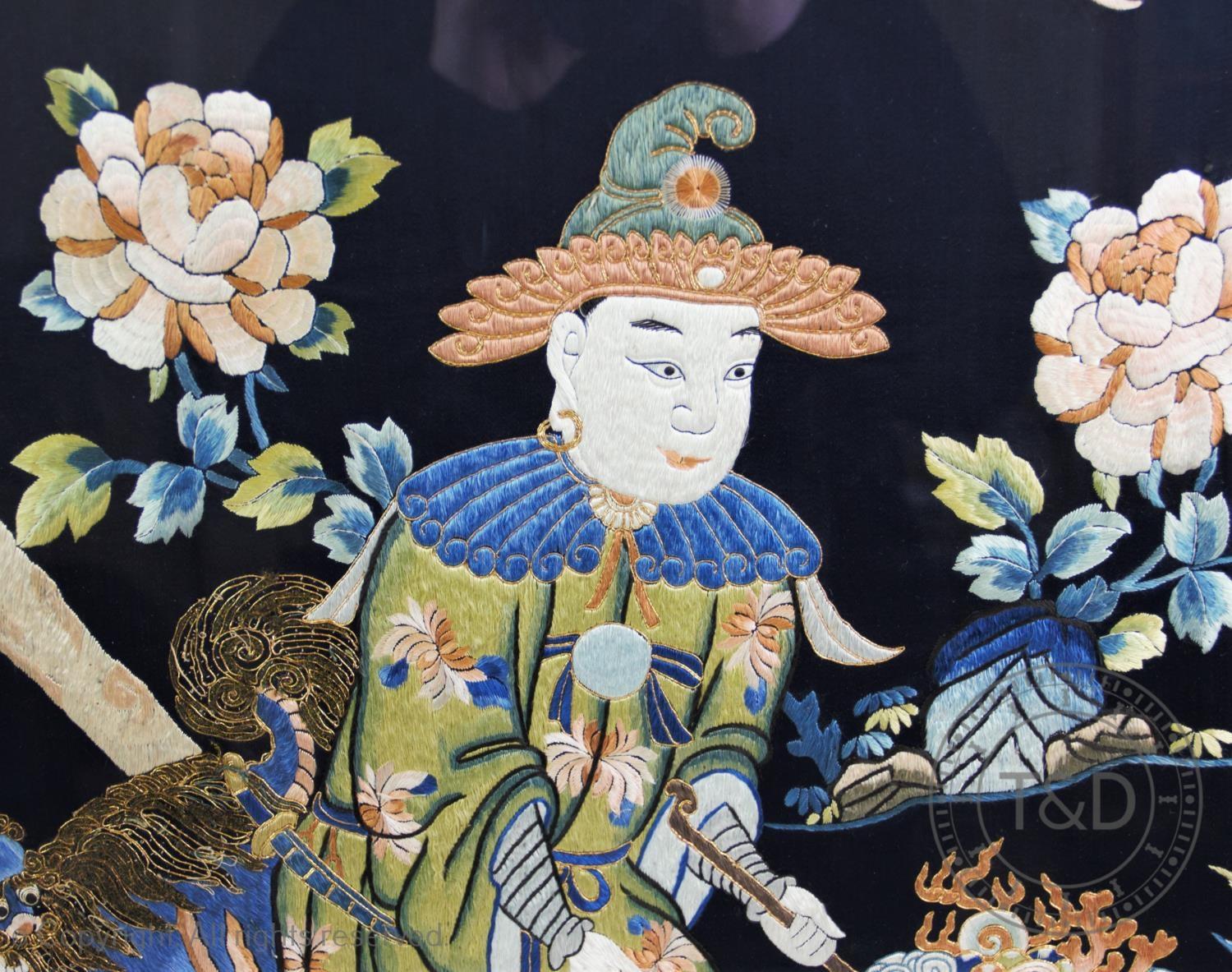 A late 19th century Chinese silk work panel, depicting a figure presenting an ivory pagoda, a dog of - Bild 2 aus 3