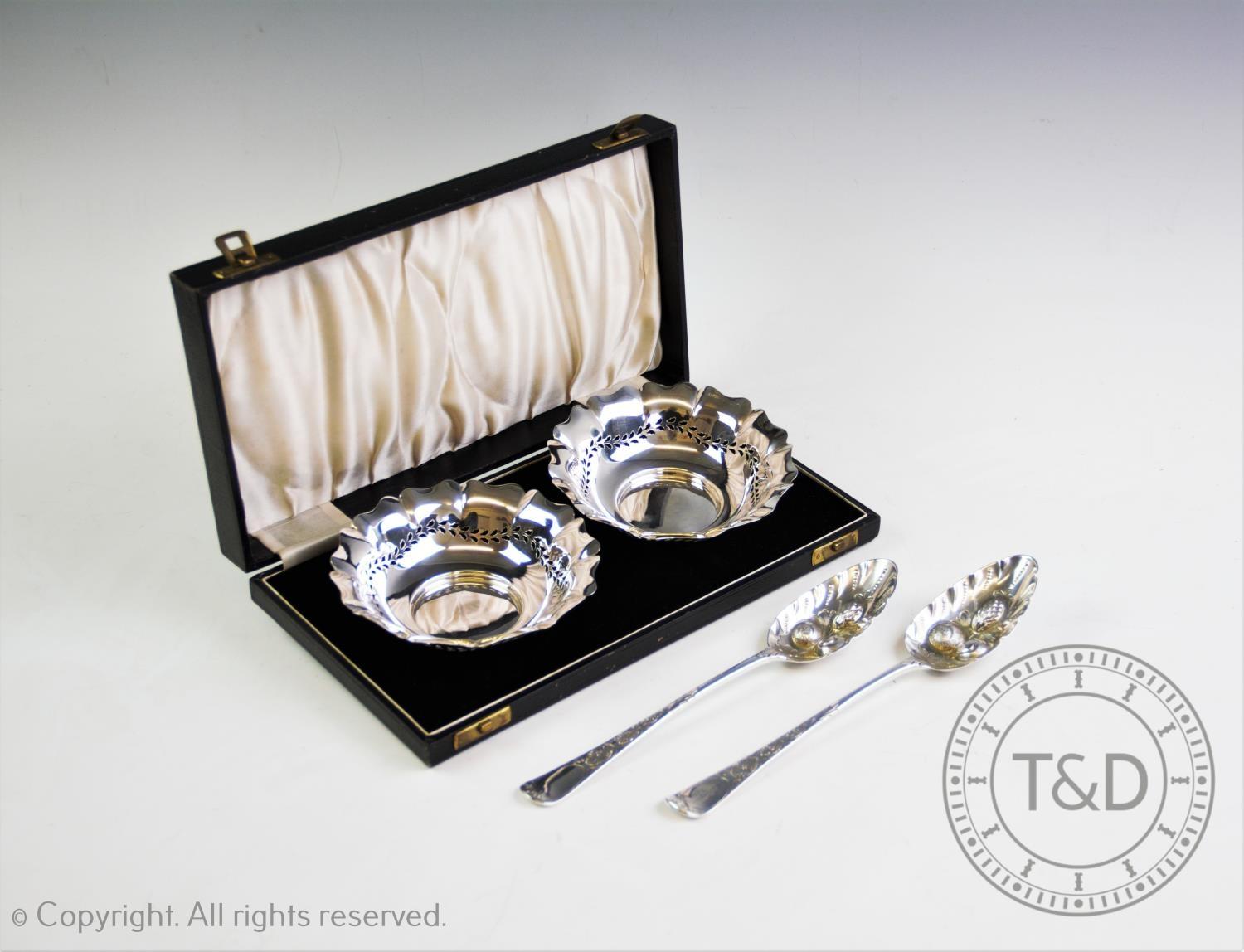 A boxed pair of pierced silver dishes by SJ Lever & Co, Birmingham 1934, cusped border with