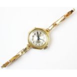 A lady's continental 18ct gold wristwatch, the engine turned dial with Arabic numerals, case size