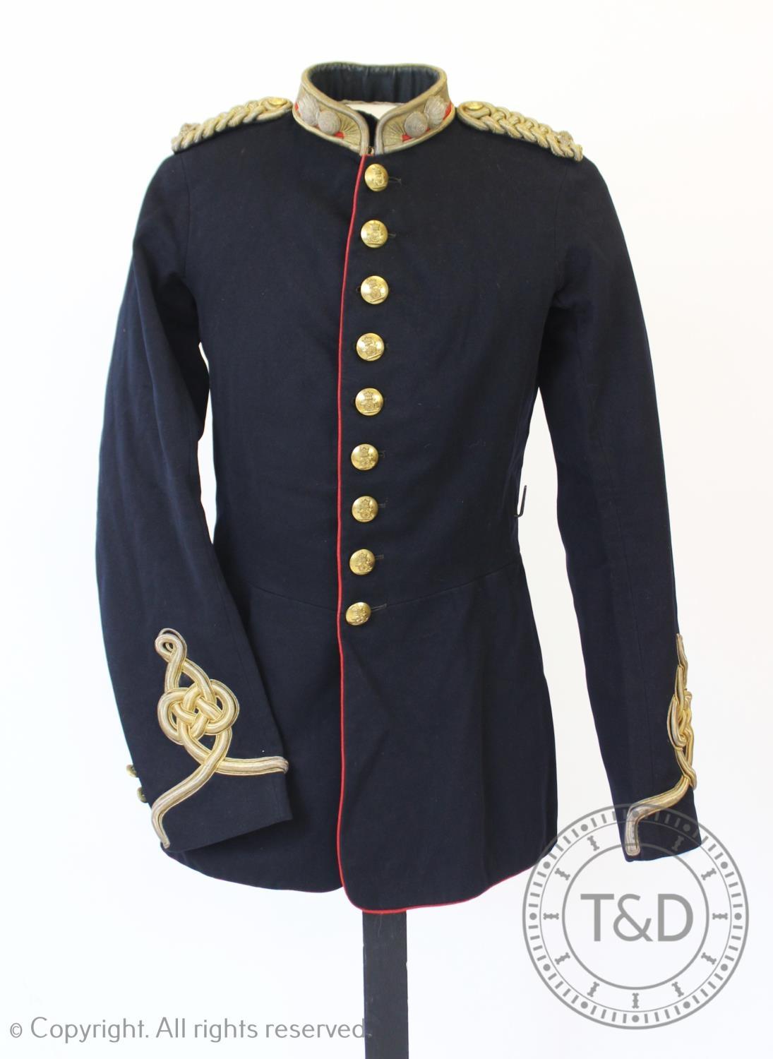 An early 20th century Royal Artillery military tunic, the navy facecloth jacket with Royal Artillery