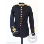 An early 20th century Royal Artillery military tunic, the navy facecloth jacket with Royal Artillery