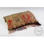 A 20th century paisley shawl, machine woven with tasseled edge, using a red, green, brown and