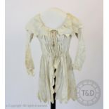 A embossed striped ivory cotton dressing jacket, circa 1795, possibly maternity, the collar and