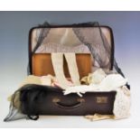 A suitcase containing a pair of lace gloves said to have been worn to 'Waterloo Ball' 1815,