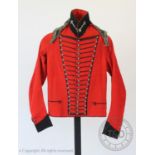 An early 20th century Cheshire Cavalry jacket and associated trousers, the jacket with navy braiding
