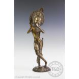 A bronze religious statue, Krishna, modelled wearing an elaborate headdress and attire upon a