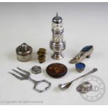 A selection of silver and white metal items, comprising: a white metal tape measure with embossed