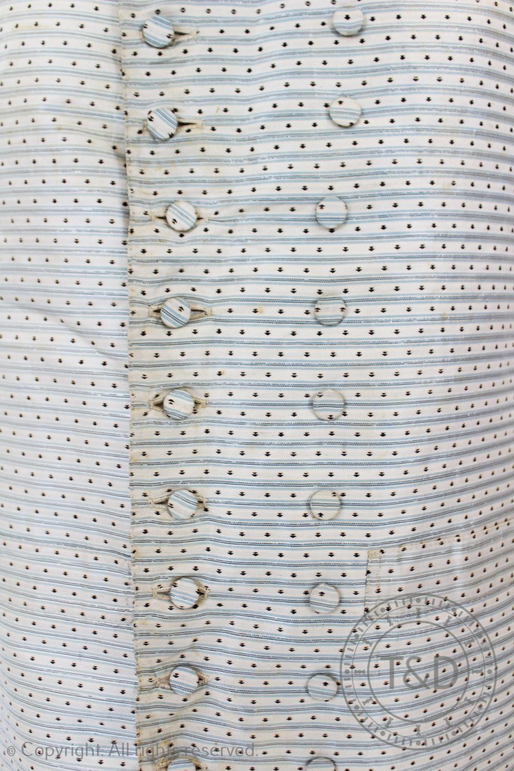 An ivory striped woven cotton waistcoat, circa 1800, the edges decorated with foliate sprays and - Image 8 of 9