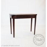 A George III mahogany demi-lune tea table, on tapered legs, 75cm H x 92cm W x 45cm D