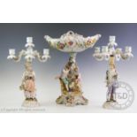 A Sitzendorf bisque glazed porcelain centre piece, modelled as a courting couple with lamb and