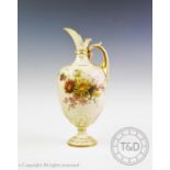 A Royal Worcester blush ivory ewer of pedestal baluster form, decorated with hand painted floral