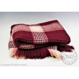 A vintage honeycomb blanket in claret and cream checked pattern, with tasseled edges, 194cm x 130cm