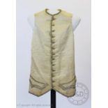 A cream ribbed silk metallic woven waistcoat, circa 1800, decorated with metallic thread and sequins