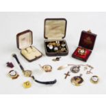 A lady's wristwatch stamped '9ct', with an assortment of yellow metal pendants and mounts, a