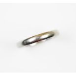 A platinum wedding band, the plain polished band with hallmarks to inside shank, ring size N, weight