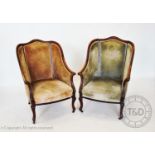 A pair of Victorian mahogany framed tub chairs, each chair with a hump back extending to down-