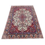 A Persian Kashmar carpet, decorated with a bespoke floral design, 206cm x 323cm