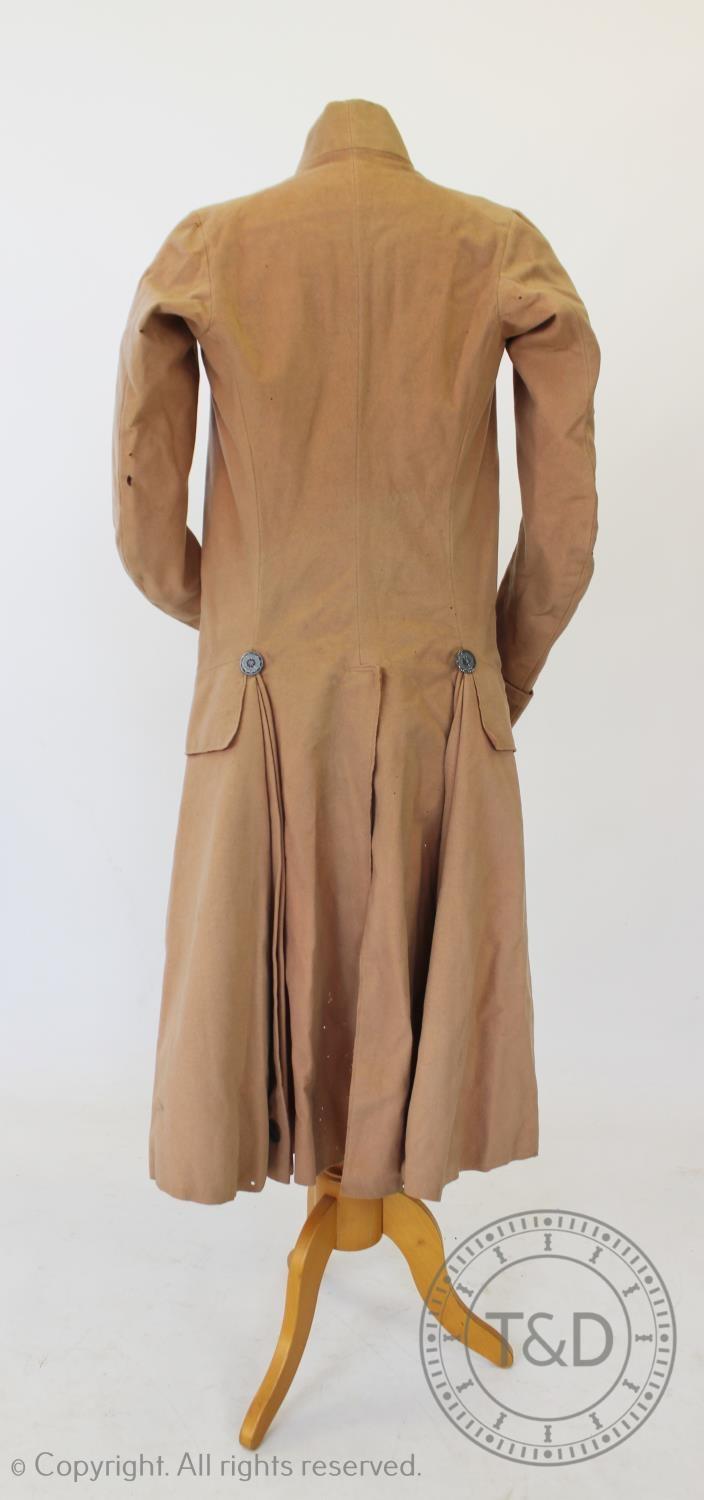 A blush wool frock coat, circa 1790, with pierced silvered metal buttons to front and back (at - Image 4 of 4