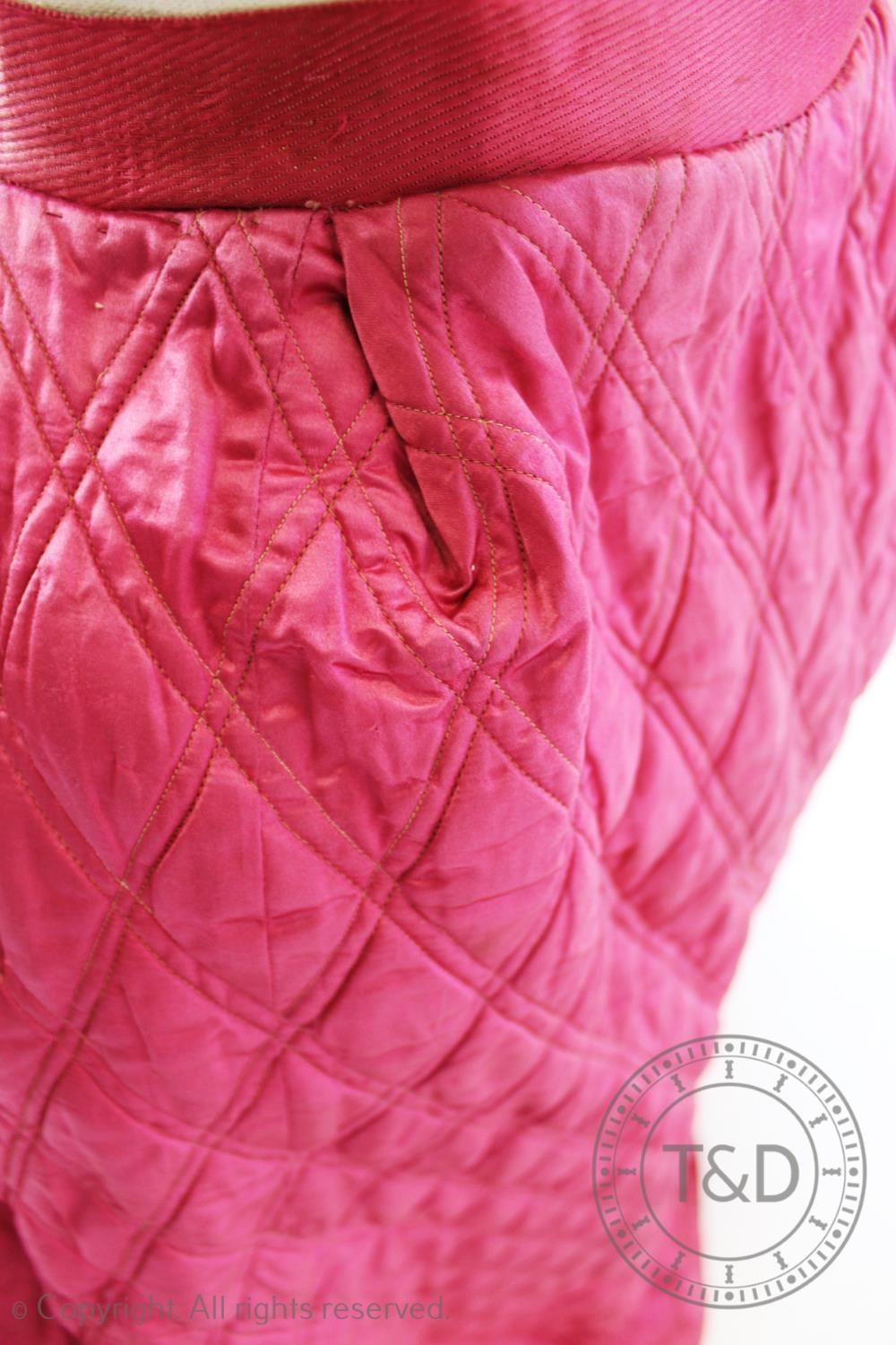 A fuscia silk quilted petticoat, circa 1845, with diamond quilted detail to the front and back and - Image 4 of 4