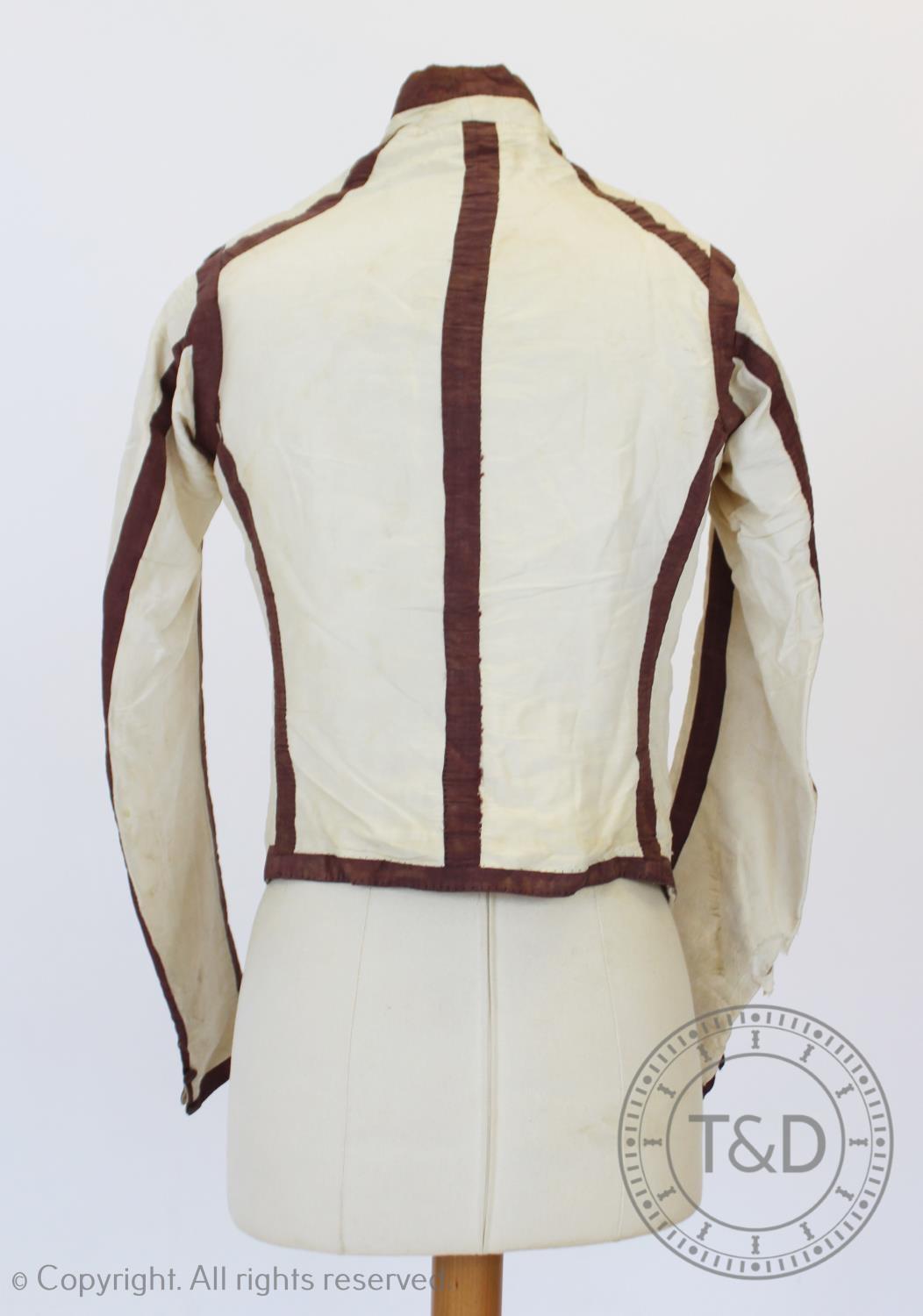 An ivory silk taffeta sleeved waistcoat or jacket, circa 1810, boldly banded and edged in dark plum, - Image 3 of 5