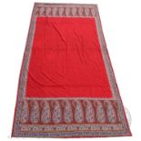 A mid 19th century paisley shawl, with scarlet red centre, the edge decorated with boteh in a