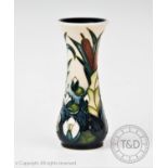 A Moorcroft slim baluster vase of small proportions, decorated in the 'Lamia' design by Rachel