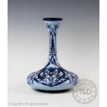 A Moorcroft yacht vase in a blue on blue floral design by Rachel Bishop 2003, manufacturing mark for