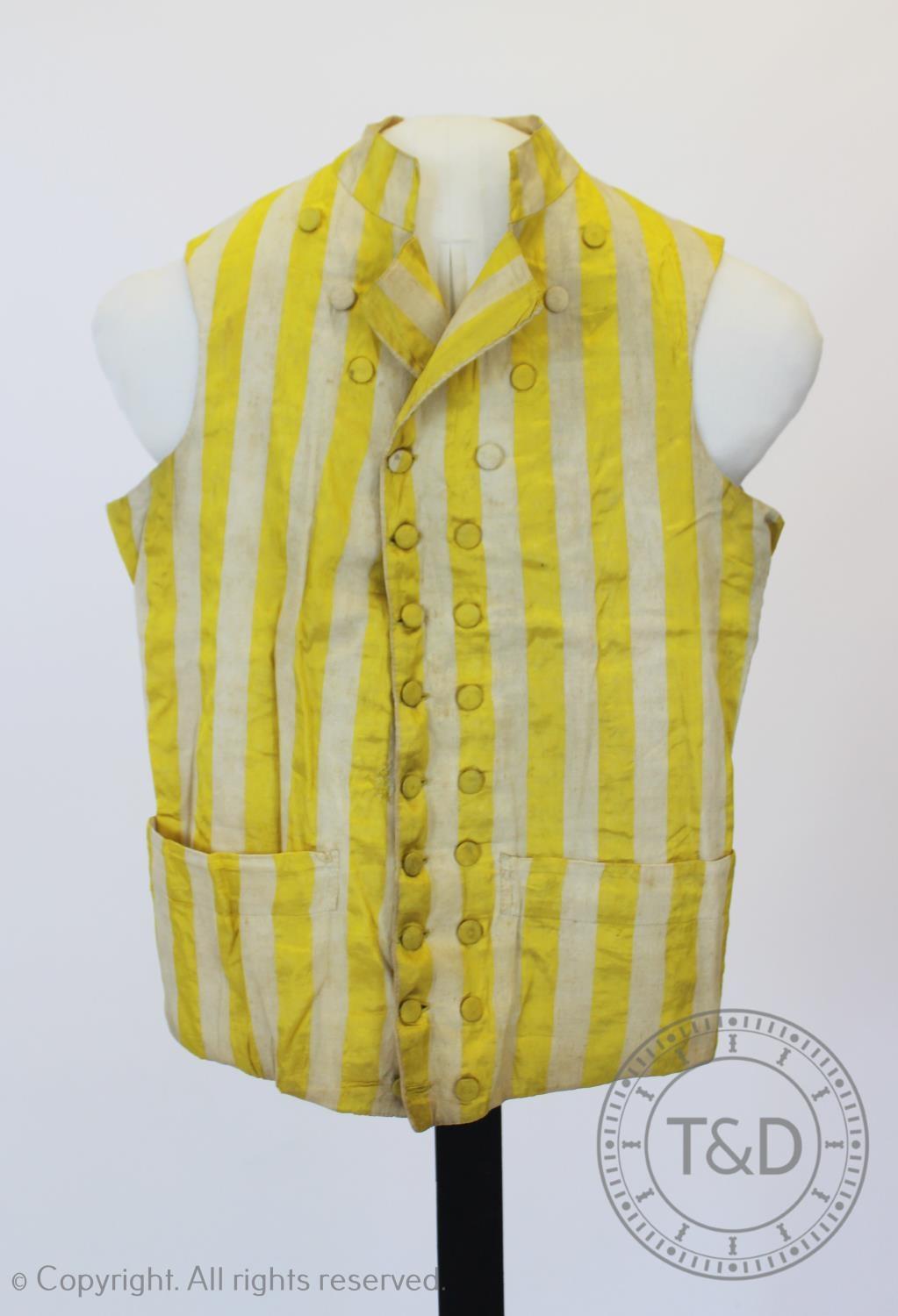 A yellow and ivory striped cotton double breasted waistcoat, circa 1800, with covered buttons,