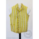 A yellow and ivory striped cotton double breasted waistcoat, circa 1800, with covered buttons,