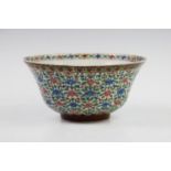 A 19th century Chinese porcelain circular bowl, decorated profusely with blue and pink flora and
