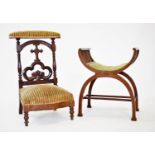 A Victorian walnut prie dieu chair, with a padded top rail above an open work trefoil Gothic splat