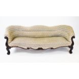 A William IV serpentine rosewood settee, the undulating padded back above a sprung serpentine
