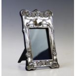 An Edwardian Art Nouveau silver frame, Horton & Allday, Birmingham 1904, of rectangular form,