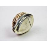 A 20th century white metal mounted cowry shell snuff box, the shell designed with white metal