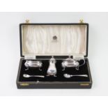 A cased silver condiment, Mappin & Webb Ltd, Birmingham 1957, comprising: a pepperette, a salt and a