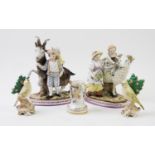 A pair of late 19th century continental ceramic groups, both modelled as children with goats, the