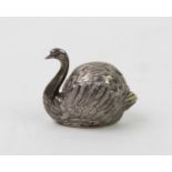 A Chinese white metal novelty swan pepper pot, with engraved feather detailing, pierced holes to
