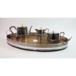 An oak gallery tray, of oval form with central shield medallion and pierced rim, 68cm wide, with a