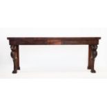 A Regency and later mahogany serving table, the rectangular top on associated leopard head carved