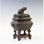 A Chinese bronze koro and cover, late 18th/early 19th century, of rounded, rectangular form chased