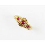 An early 20th century diamond and ruby set 18ct gold ring, comprising alternating claw set mixed cut