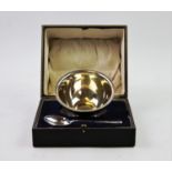 A George V silver christening set, comprising: a silver bowl, Atkin Brothers, Sheffield 1919, of