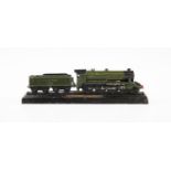 A cast metal model of a steam locomotive and tender, base stamped 'King Arthur Class no. 763', '